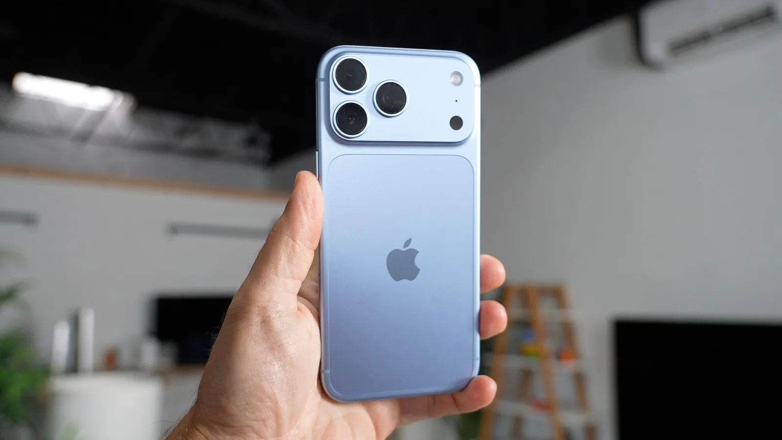 iPhone 18 Pro in glacier blue showing its camera system and smaller Dynamic Island