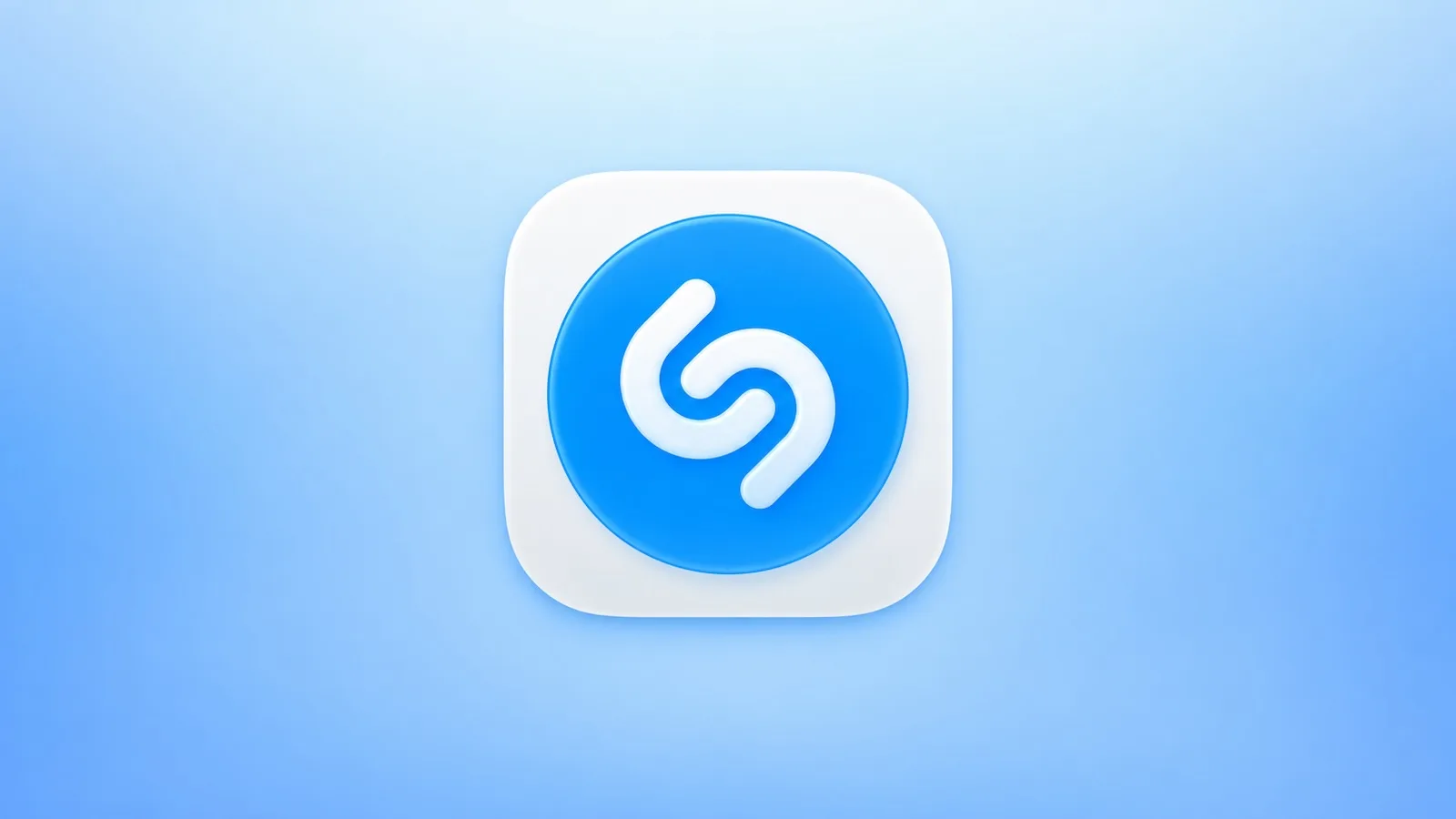 Shazam-appikon på en iPhone bredvid en panel med iMessage-klistermärken