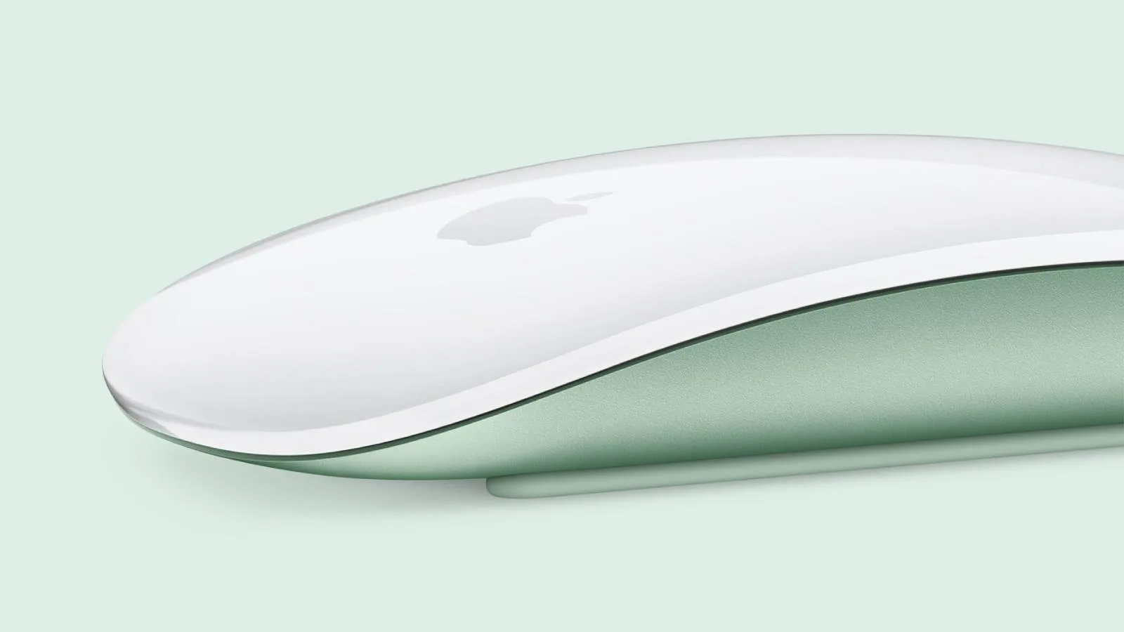 Apple Magic Mouse and Magic Trackpad beside a Mac