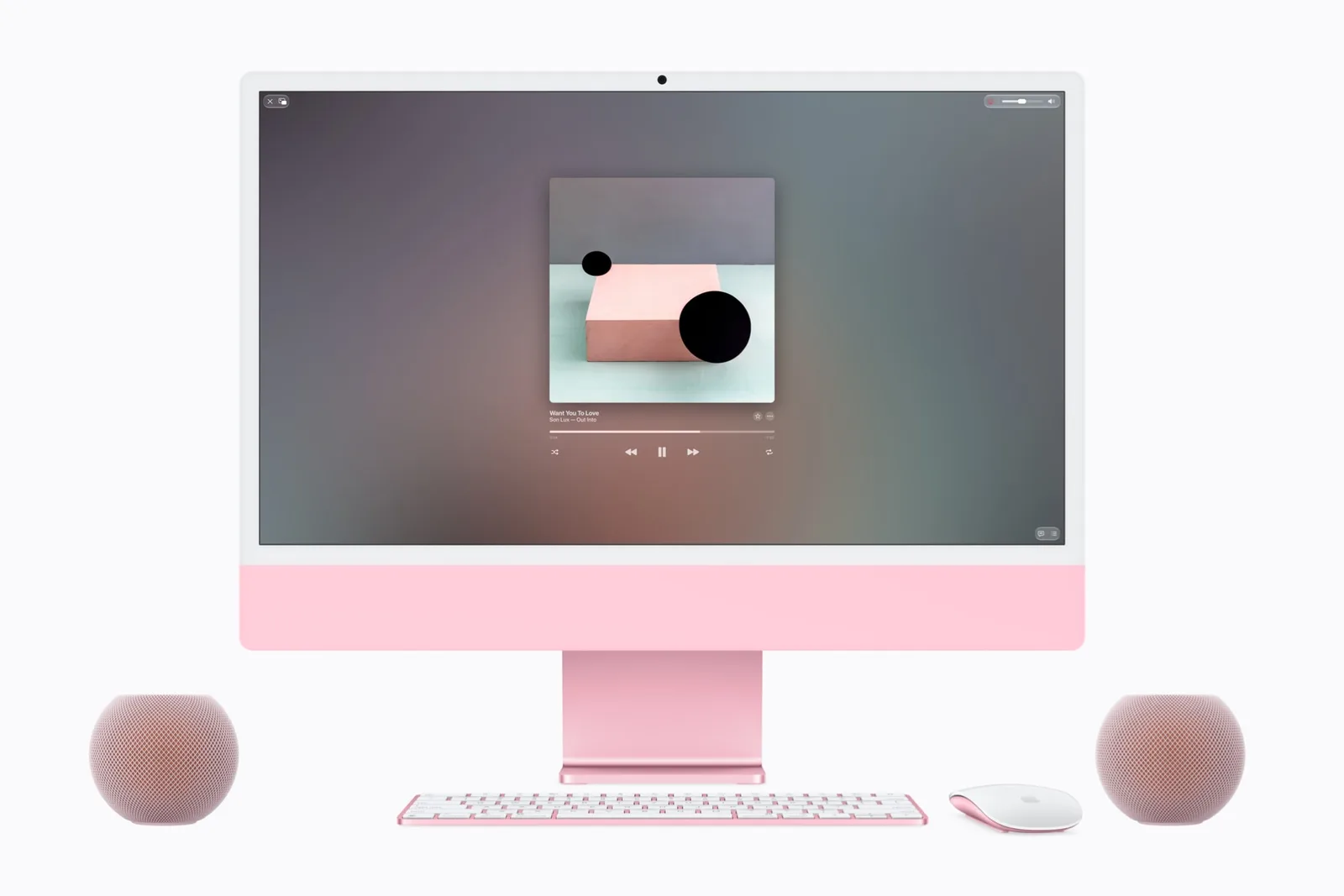 HomePod mini 2 neben einem Mac-Computer auf einem Schreibtisch