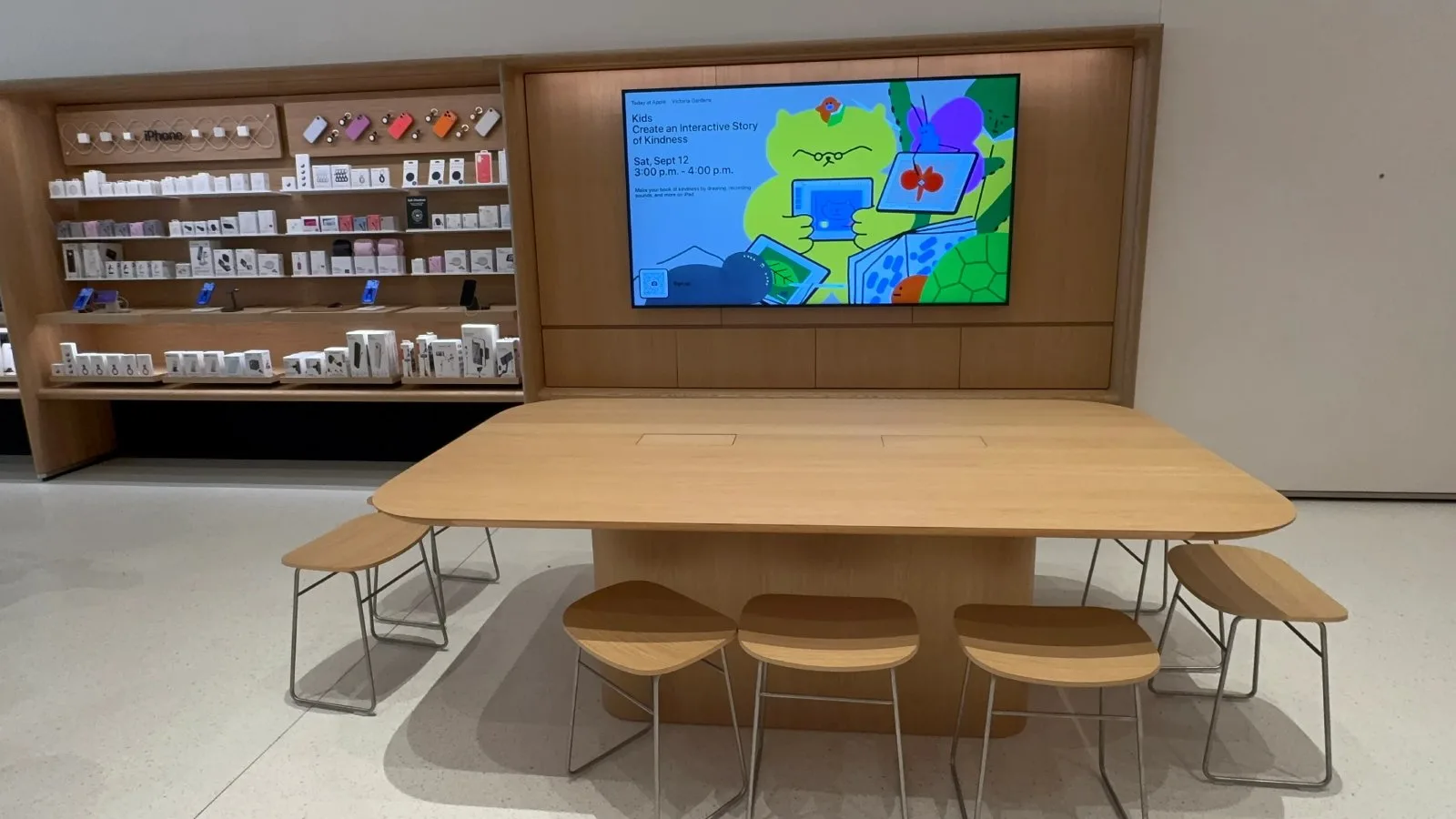 Interior of a renovated Apple retail store showing a Genius Bar and side shelving with dedicated bays